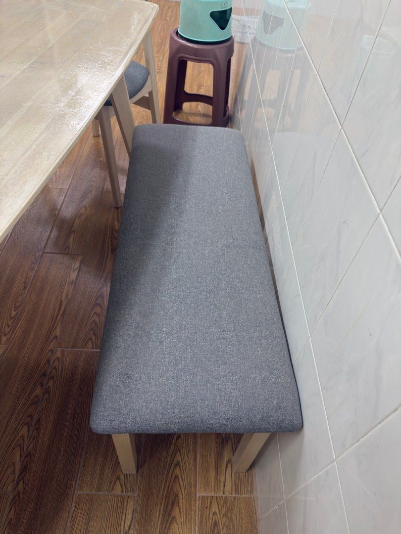 Dining Table Set (Category: Tables & Sets) located in Singapore. Submitted by durgadorita (Listing ID 1370131918, Image 2). Description: 4 grey cushioned dining chairs and a long bench that can sit upto 3pax. Seldom used and has pvc layer on top hence in very good condition. .