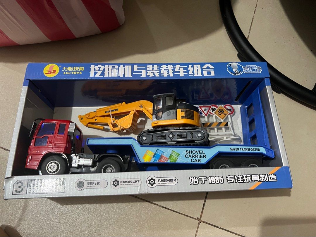 Excavator Trailer Toyt (Category: Vehicle & Diecast Models) located in Mandaluyong City. Submitted by 1hapimaki (Listing ID 1374088434, Image 1). Description: Given as a gift but with dust due to storage.