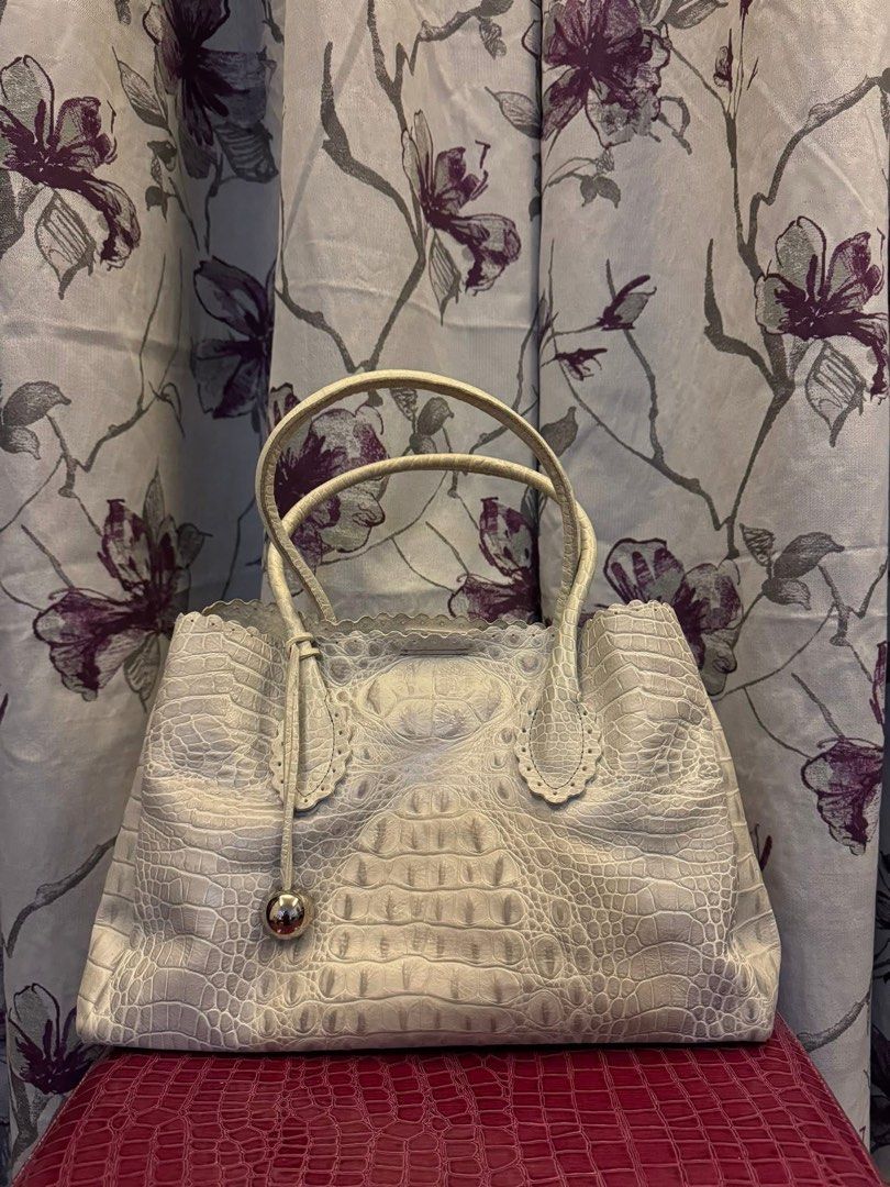 Furla crocodile leather embossed tote bag (Category: Luxury Bags & Wallets) located in Manila. Submitted by onestopboutique (Listing ID 1373997291, Image 2). Description: •100% Authentic •With dust bag •High in appeal and style •This tote from Furla comes crafted from croc-embossed leather and is equipped with dual top handles •An attached brand tag, and gold-tone hardware •The interior is fabric-lined and sized well to hold all your essentials. 