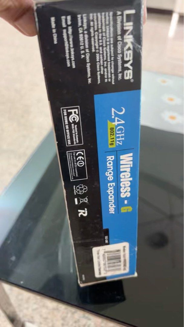 Linksys Wireless-G Range Expander (Category: Networking) located in Singapore. Submitted by pam2018 (Listing ID 1374038315, Image 1). Description: Hey there! Selling a Linksys Wireless-G Range Expander. It's a 2.4GHz range extender, perfect for expanding your wireless network coverage. The box shows the model number is WRE54G. It's a great way to boost your Wi-Fi signal and eliminate dead zones in your home or office. It's a reliable device from 