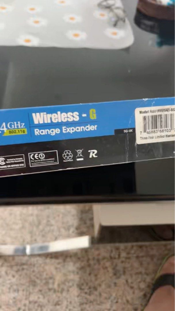 Linksys Wireless-G Range Expander (Category: Networking) located in Singapore. Submitted by pam2018 (Listing ID 1374038315, Image 2). Description: Hey there! Selling a Linksys Wireless-G Range Expander. It's a 2.4GHz range extender, perfect for expanding your wireless network coverage. The box shows the model number is WRE54G. It's a great way to boost your Wi-Fi signal and eliminate dead zones in your home or office. It's a reliable device from 