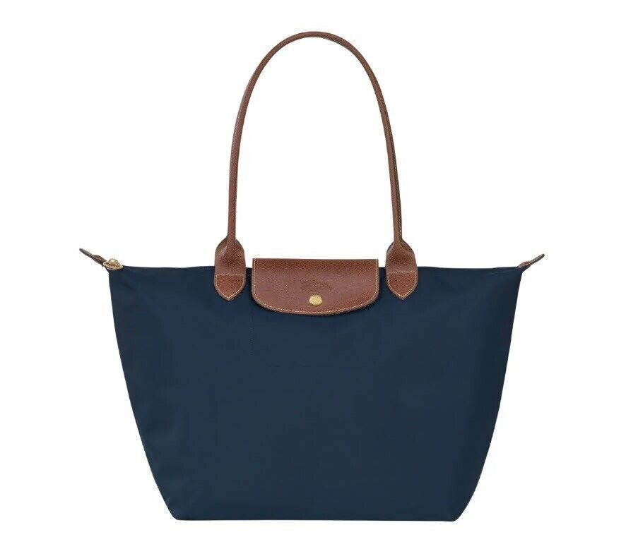Longchamp Le pliage tote bag Navy Size M/L (Category: Bags & Wallets) located in Singapore. Submitted by themagicalrealm (Listing ID 1368299745, Image 1). Description: 100% Authentic from France Brand new Size L - $138 Comes with receipt Free delivery Comes in full set! Available in other colours too so please let me know in advance if you want a different colour .