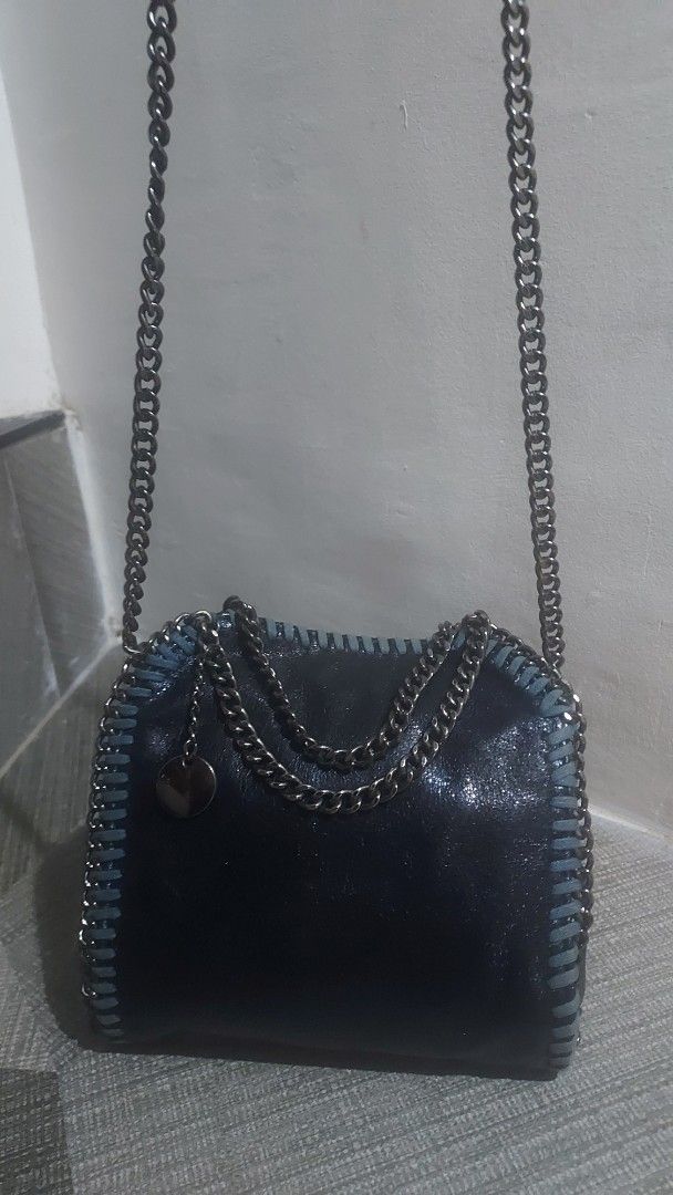 Mini Falabella Sling Bag in Midnight Blue (Category: Purses & Pouches) located in Cebu City. Submitted by mcmapio (Listing ID 1374099048, Image 2). Description: No flaws, minimal signs of usage Very Nice Material Can fit Cellphone & Medium Wallet.