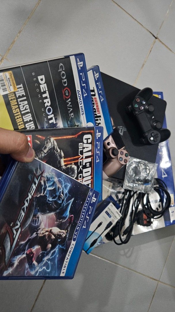 PS4 SLIM 1TB JET BLACK complete w/games (Category: PlayStation) located in Quezon City. Submitted by harry08james (Listing ID 1374047588, Image 2). Description: PS4 SLIM JET BLACK 1TB COMPLETE AND GAMES Verygood condition Issue lang yung controller both need icharge sobrang na drain hindi sya ma connect sa console pero need nang charger talaga nang ps4 controller talaga. RFS - wala na pong time mag game dahil sa work actually kahit nung kakabili 