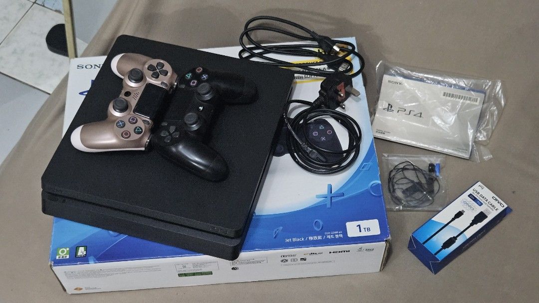 PS4 SLIM 1TB JET BLACK complete w/games (Category: PlayStation) located in Quezon City. Submitted by harry08james (Listing ID 1374047588, Image 3). Description: PS4 SLIM JET BLACK 1TB COMPLETE AND GAMES Verygood condition Issue lang yung controller both need icharge sobrang na drain hindi sya ma connect sa console pero need nang charger talaga nang ps4 controller talaga. RFS - wala na pong time mag game dahil sa work actually kahit nung kakabili 