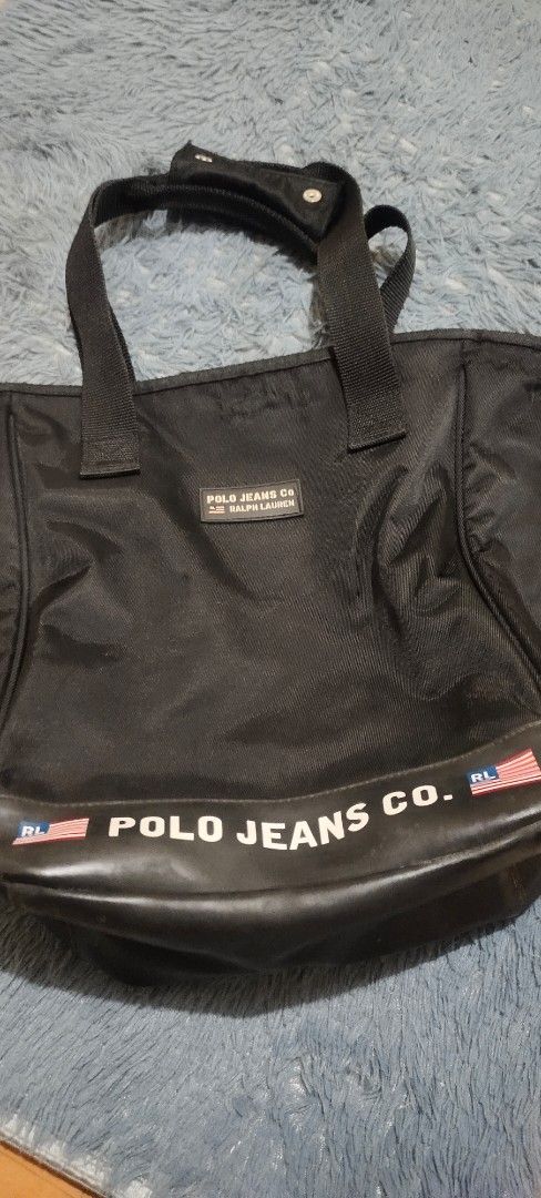 Ralph Lauren Shoulder Bag (Category: Luxury Bags & Wallets) located in Quezon City. Submitted by thesyc (Listing ID 1373967427, Image 1). Description: Authentic Vintage 90’s Polo Sport Ralph Lauren Tote Shoulder Bag. ✅ Well Used with minimal flaw but barely noticeable. ✅Color Black ✅RFS: Declutter, need funds. PM for more details. Thank you and Godbless.