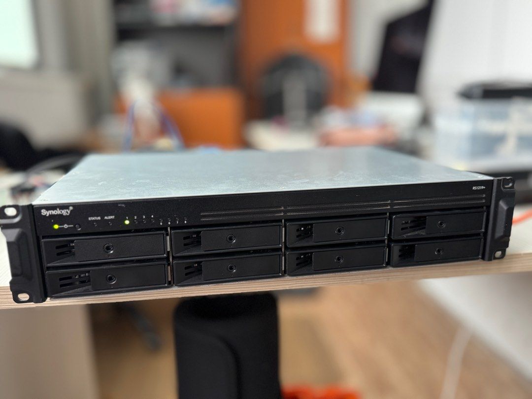 The Synology RackStation RS1219+ is a 2U rackmount NAS server designed for small to medium-sized businesses. (Category: Office & Business Technology) located in Singapore. Submitted by pc.pitstopsg (Listing ID 1374041931, Image 1). Description: The Synology RackStation RS1219+ is a 2U rackmount NAS server designed for small to medium-sized businesses. It offers scalability, with support for up to 12 drives when combined with an optional RX418 exp