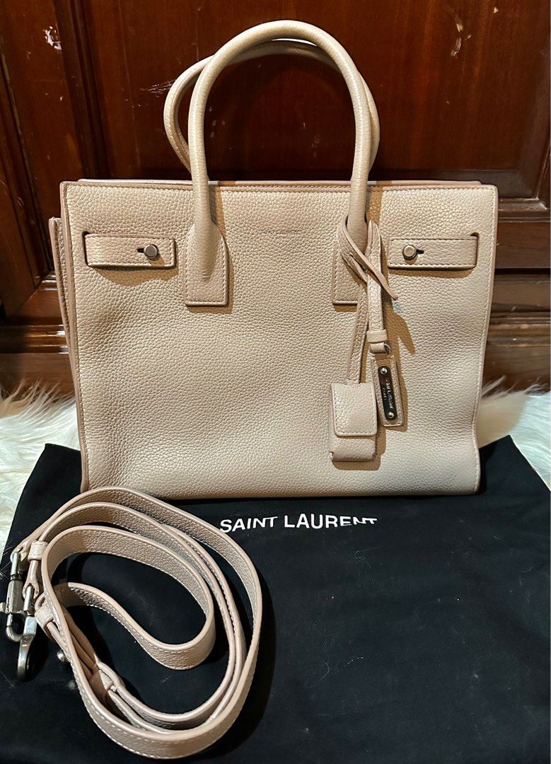 Authentic YSL baby sac de jour (Category: Luxury Bags & Wallets) located in Quezon City. Submitted by lux4less4u (Listing ID 1374221001, Image 1). Description: 💯Authentic YSL baby sac de jour calf skin leather color blush pink with dustbag, key & lock, detachable strap last picture for size reference only price slightly negotiable no low ballers, serious buyers only .