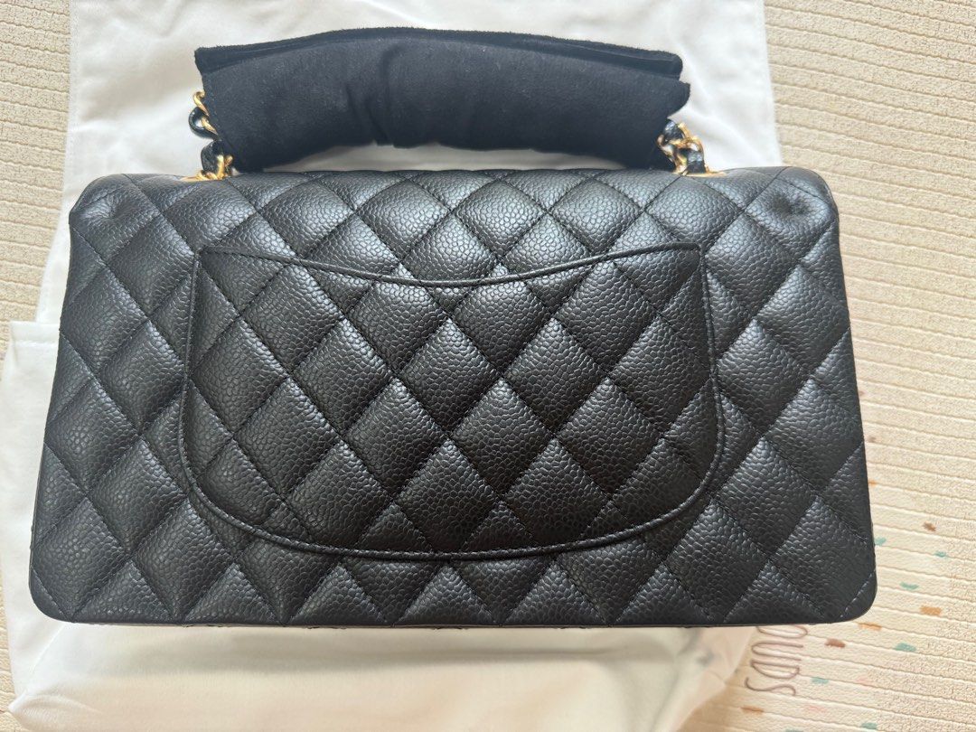 Chanel Classic Medium Flap - Caviar (Category: Bags & Wallets) located in Singapore. Submitted by lazybear__ (Listing ID 1374143473, Image 2). Description: - BNWB - Unused asp picture - Protective sticker all still intact - bought dec 2024 at taka boutique - Microchip in bag - Zip and chain are protected since day 1 (refer to pic) - if you can see listing, is still available. don’t come back stupid qns. - it has been verified by Caorusell Lux via