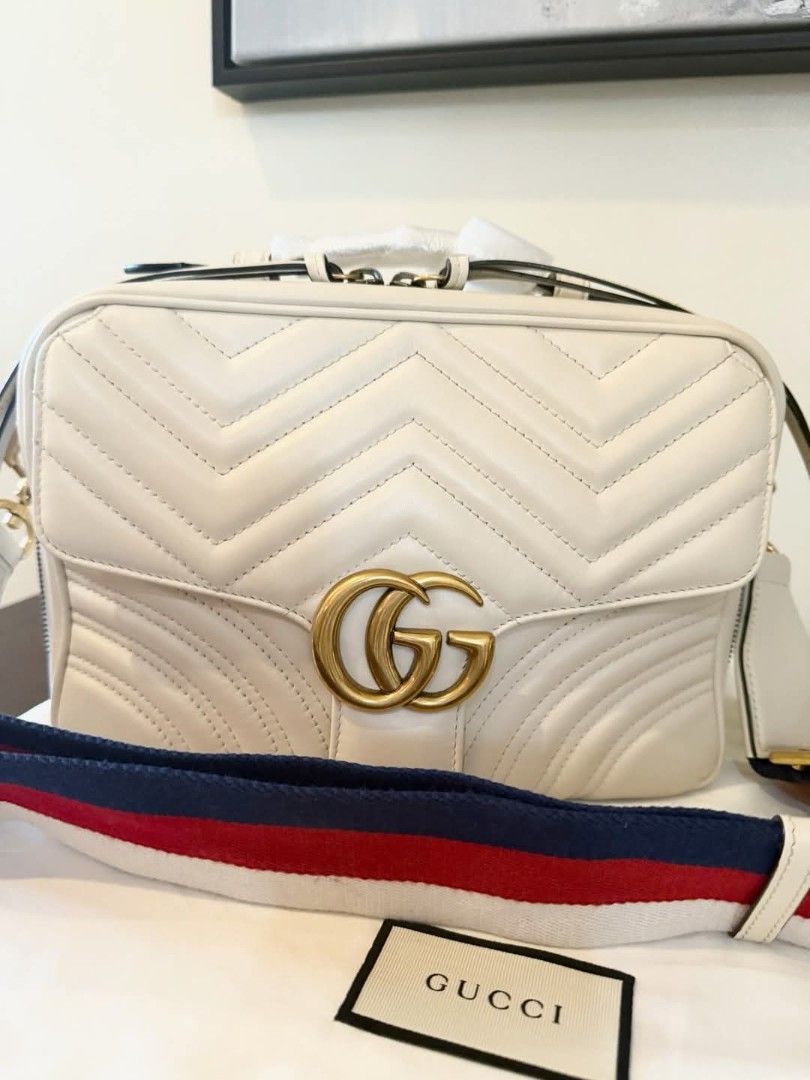 Gucci GG Marmont Top Handle with Web Strap (Category: Luxury Bags & Wallets) located in Quezon City. Submitted by gielyn2 (Listing ID 1374175291, Image 2). Description: ✨ FOR SALE: GUCCI GG MARMONT SMALL TOP HANDLE BAG with WEB STRAP ✨ 💼 LIKE NEW – Used only a few times, with no visible signs of wear! 📍 Pick-Up: Quezon City Add instant elegance to your wardrobe with this stunning Gucci GG Marmont Top Handle Bag in white chevron matelassé calfsk