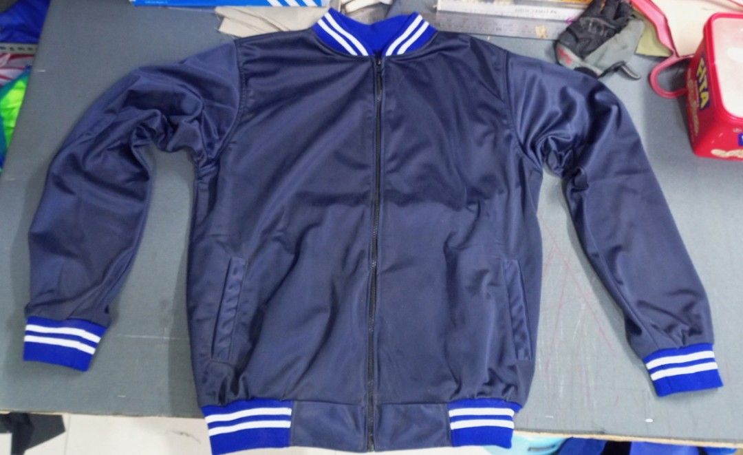 Varsity Jacket (Category: Activewear) located in Manila. Submitted by esteemed_shop (Listing ID 1374203415, Image 1). Description: 🧥 Slide 1: Classic Varsity Style, Elevated Step into timeless fashion with our Navy Blue Varsity Jacket – a perfect blend of vintage athletic vibes and modern streetwear flair. 💙 Slide 2: Premium Comfort Crafted with high-quality, smooth fabric for a sleek feel and lasting comfort. Lightweight but warm – ideal for s