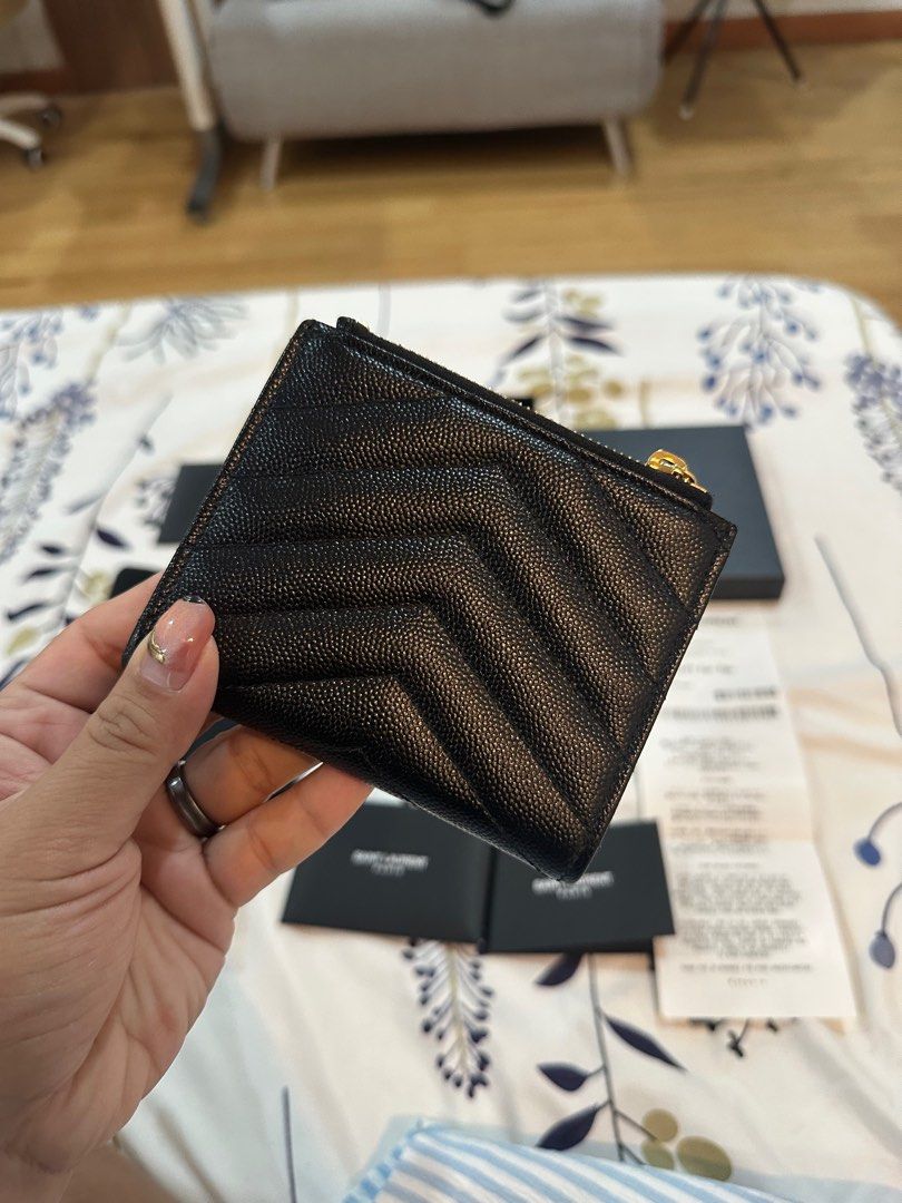 YSL Monogram Bifold Wallet (Category: Luxury Bags & Wallets) located in Caloocan City. Submitted by mnl.seconds (Listing ID 1374144841, Image 3). Description: Bought from Tokyo All inclusions still intact including paper bag Gift receipt from the store still included Super seldom used Rfs: i want a new bag.