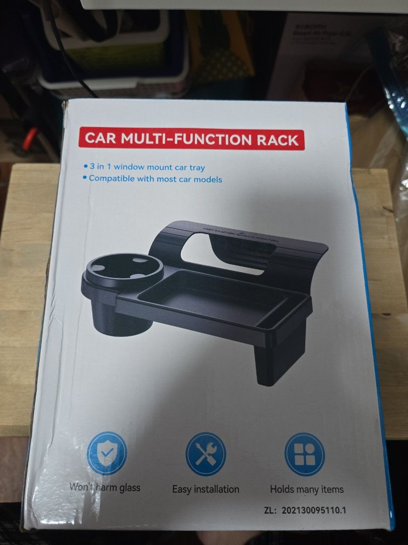 Car Multi Function Rack (Category: Storage & Organization) located in Singapore. Submitted by r3gine (Listing ID 1374348117, Image 2). Description: Check out this brand new car multi-function rack! It's designed to securely hold your phone while you're on the road. The rack appears to be easy to install and adjust, providing a convenient and safe way to use your phone for navigation, calls, or music. It's a great accessory for any car, keeping yo