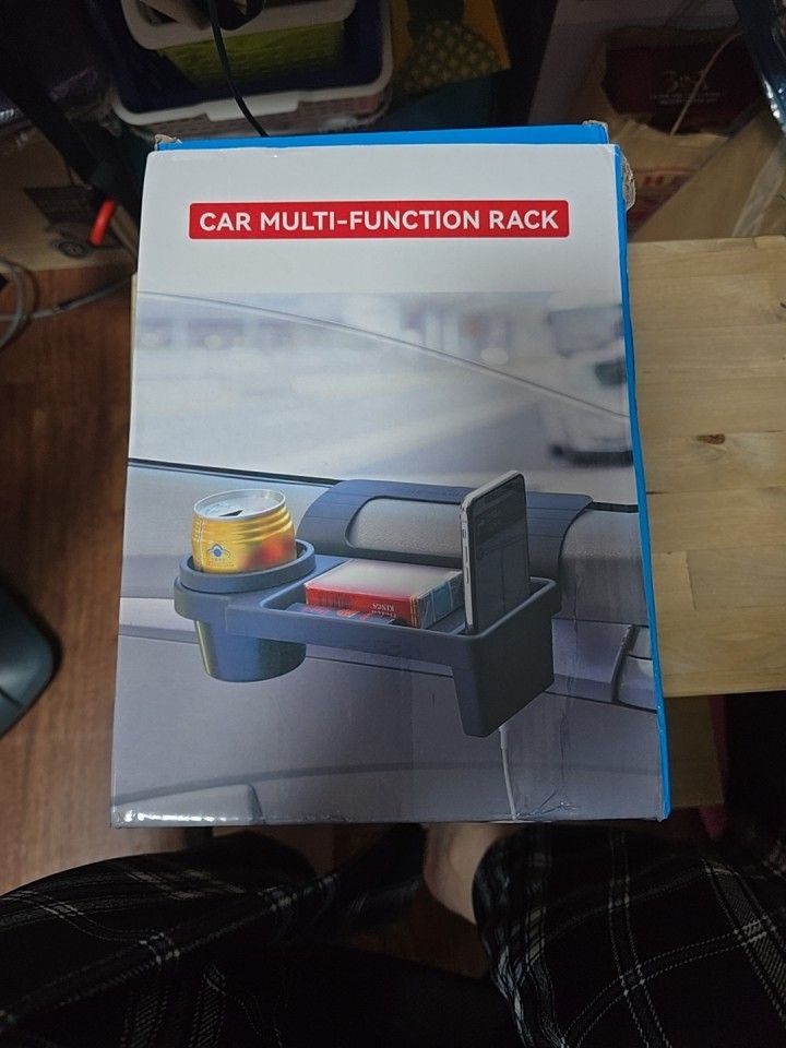 Car Multi Function Rack (Category: Storage & Organization) located in Singapore. Submitted by r3gine (Listing ID 1374348117, Image 1). Description: Check out this brand new car multi-function rack! It's designed to securely hold your phone while you're on the road. The rack appears to be easy to install and adjust, providing a convenient and safe way to use your phone for navigation, calls, or music. It's a great accessory for any car, keeping yo