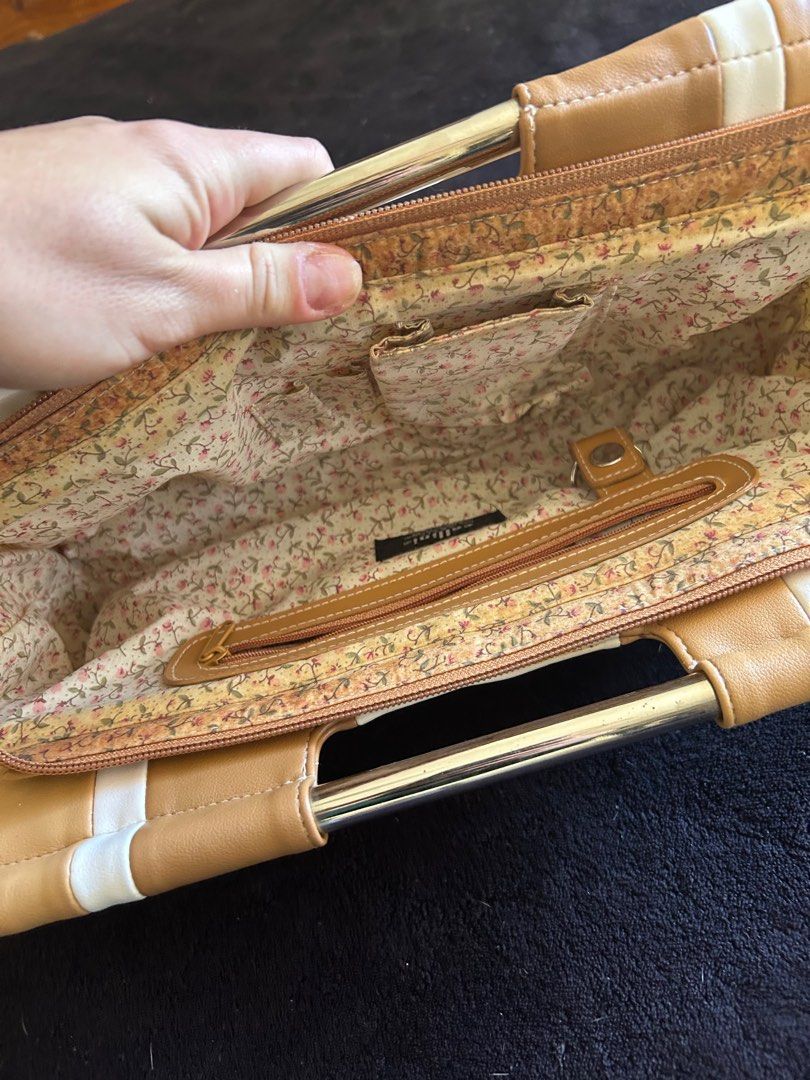 Cellini Sport Handbag (Category: Women's Bags & Wallets) located in Gold Coast. Submitted by misstee627 (Listing ID 1374355378, Image 2). Description: Clutch handbag with metal handles. Slight discolouration inside. .