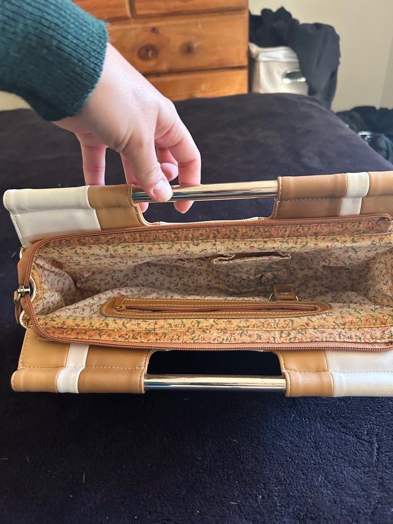 Cellini Sport Handbag (Category: Women's Bags & Wallets) located in Gold Coast. Submitted by misstee627 (Listing ID 1374355378, Image 3). Description: Clutch handbag with metal handles. Slight discolouration inside. .