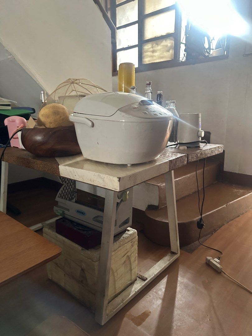 Dining table for 4 (Category: Other Kitchenware & Tableware) located in Quezon City. Submitted by gellyshot (Listing ID 1374463984, Image 1). Description: Just trying to get rid of it. Can still be repaired by replacing the plastic cover on top. Has some scuffs etc. It’s a table made by a local designer. Can be picked up by June 20 onwards Pick up is near robinsons magnolia. .