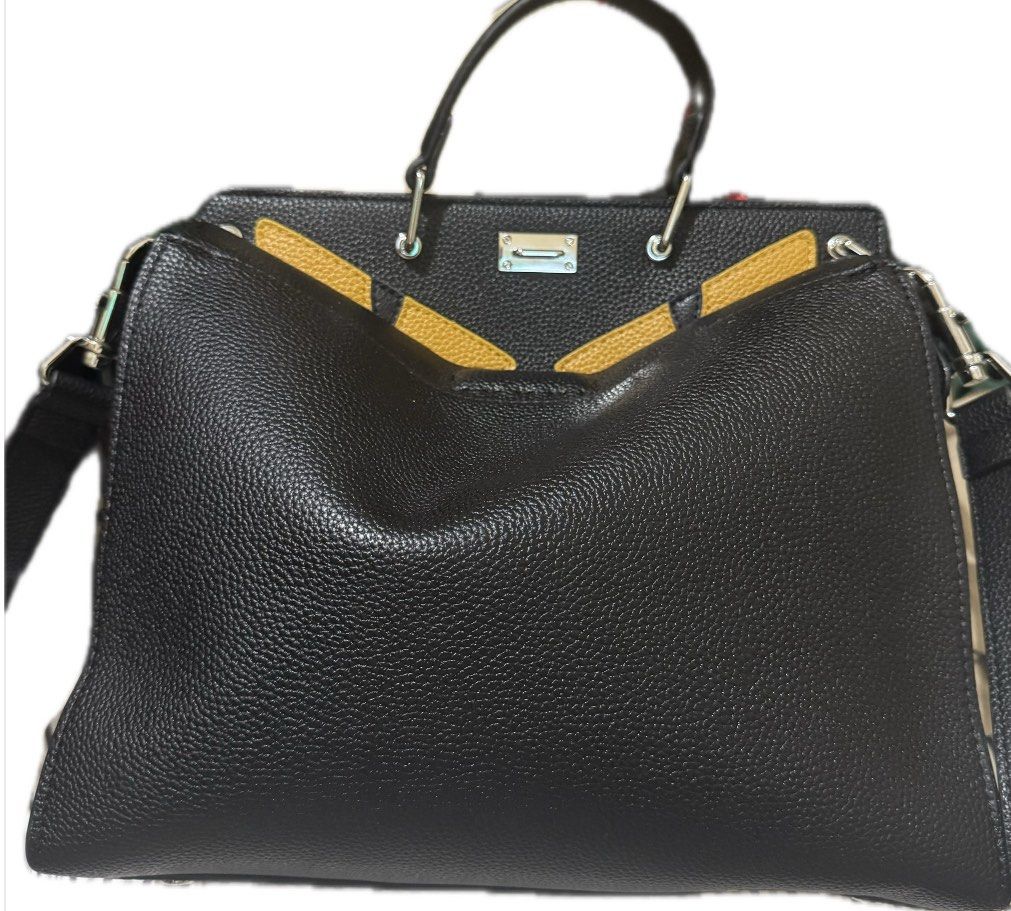 Fendie Peekabo Monster Sling 31cm (NGA) (Category: Cross-body Bags) located in Manila. Submitted by titomarsy (Listing ID 1374437129, Image 1). Description: NGA Used once for an event, and in very good condition. Two compartments, one side zipper/one side hook. Small Dimensions: 31 × 23 cm No box, nor dust bag. PM for other queries. .