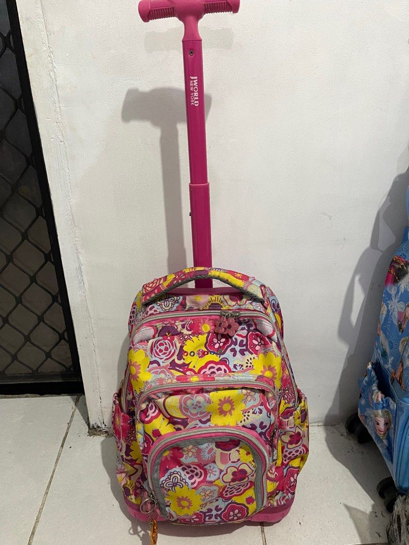 J World New York trolley bag (Category: Other Babies Going Out Needs) located in Caloocan City. Submitted by kisyabooknerd (Listing ID 1374435877, Image 3). Description: Bought for $59 With my daughter's name but can be erased, I think🥲 Zippers all working Wheels still lights up and working.
