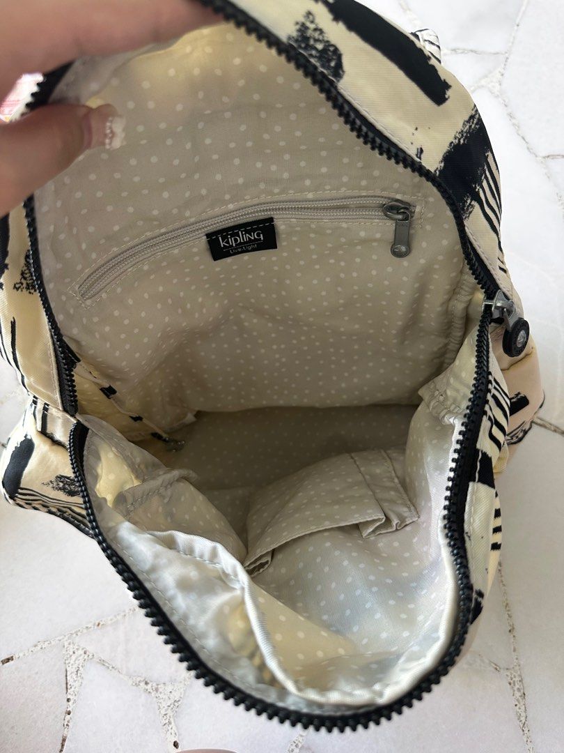 Kipling Mini Backpack (Category: Backpacks) located in Singapore. Submitted by tinkerbellzy (Listing ID 1374393552, Image 5). Description: Selling it for $20, bag is as good as new Theres abit of stain on the button (shown in the last pic), but button functioning well~ Bag is as good as new, used once.