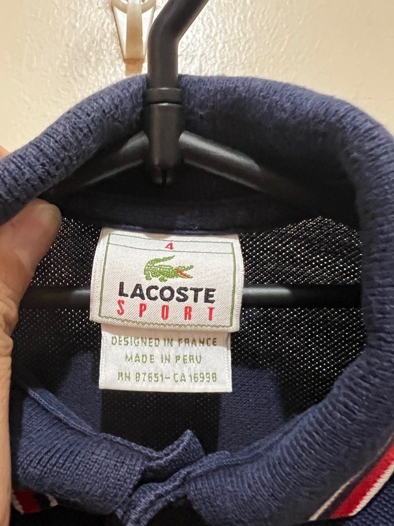 Lacoste Sport polo navy blue (Category: Babies & Kids Fashion) located in Quezon City. Submitted by deviljin17 (Listing ID 1374432338, Image 2). Description: Lacoste Sport polo navy blue Size 4 on tag 13 x 16.5”.