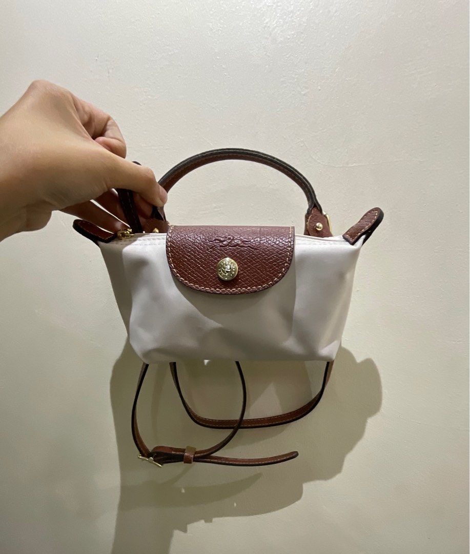 Longchamp Mini With STRAPS (Category: Luxury Bags & Wallets) located in Manila. Submitted by _girlfinds (Listing ID 1374354435, Image 2). Description: 👜 LONGCHAMP LE PLIAGE – JAPAN SOURCED Elevate your daily style with this classic and functional Longchamp tote. 📍 Sourced directly from Japan – self authentication with the provided photos, premium quality. 🚫 No cancellation of orders 🛑 Low-ballers = blocked 🛍️ If unsure, feel free to purchase