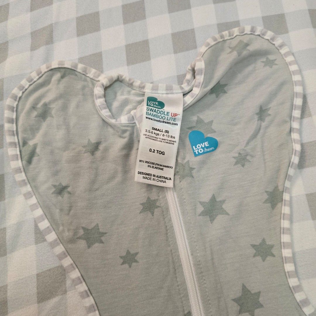 Love to Dream Swaddle 0.2 TOG Small (Category: Babies & Kids Fashion) located in Marikina City. Submitted by grcpw (Listing ID 1374511344, Image 2). Description: Love to dream swaddle used for 1 and half mos only. 1,000 each. Retails at 1,999.00 since 0.2 TOG. Perfect for PH weather. I used this kahit afternoon nap lang na walang AC since manipis naman. Blue Green - Lite Big Stars - Bamboo Lite Used but not abused, since saglit lang naisuot. Kina