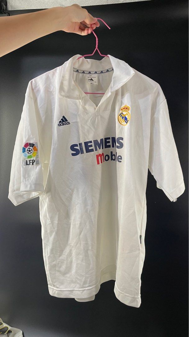Real Madrid 2002-03 Centennial Home (Category: Activewear) located in Singapore. Submitted by ego_ista (Listing ID 1374446256, Image 1). Description: Released for 2002-03 season to celebrate the club's 100th anniversary. It comes with club legend, Raul's nameset. Price is negotiable .