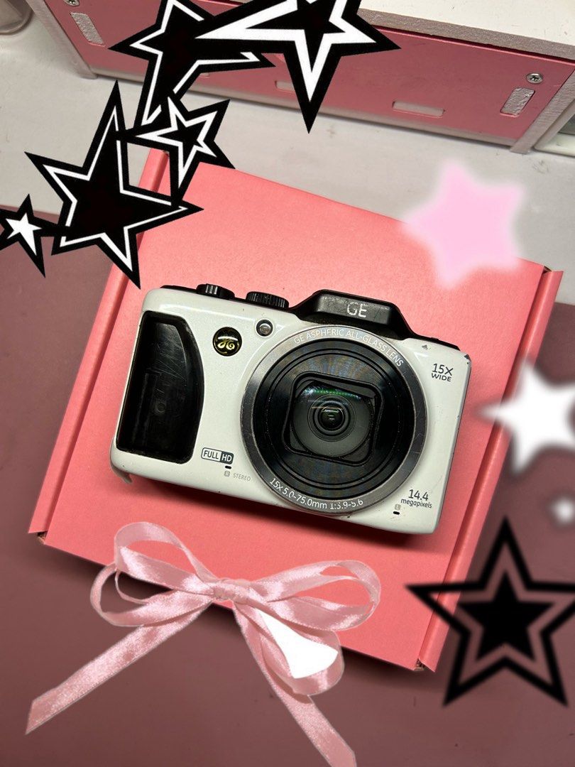 SALE GE G100 digital camera digicam (Category: Cameras) located in Lagonoy. Submitted by nadayojiii (Listing ID 1374476883, Image 1). Description: GE G100✨ 3.8k onlyyy -no functional issues -flash working -zoom working -battery door sometimes doesn’t lock(not a major flaw) -all buttons working -pop up flash✨ Inclusions: -unit -battery -charger -beaded strap -pouch -stickers.