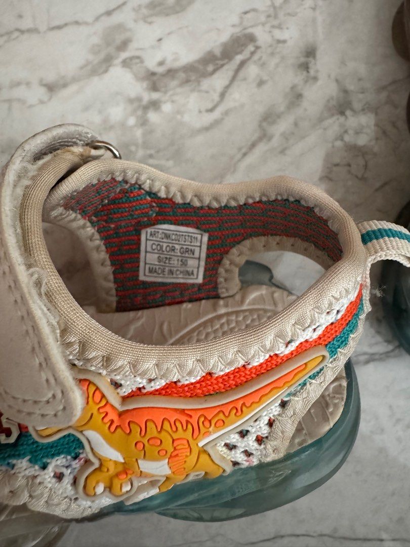 Toddler boy girl dinosaur Dinosoles shoes with lights (Category: Babies & Kids Fashion) located in Singapore. Submitted by cyndi23cherry (Listing ID 1374431481, Image 2). Description: Size 150 Actual shoes look must nicer than pic. as the lights are very bright! Seldom wear. Great condition!.
