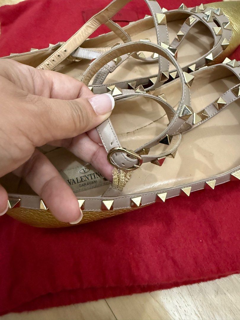 Valentino Rockstud Caged Ballet Flats in gold (Category: Flats & Sandals) located in Paranaque City. Submitted by msurfer (Listing ID 1374377757, Image 3). Description: Authentic Valentino Rockstud Caged Ballet Flats – Gold ✨ Minor scuffs and slight discoloration 🔧 The strap’s elastic is already loose but can be replaced 🩰 Still in good condition and fully restorable 👠 Size 41 – fits like 39.5 to 40 due to narrow fit 📦 Comes complete with box