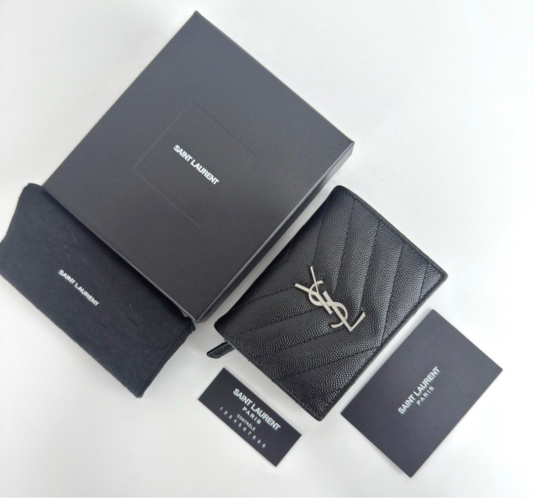 Ysl Monogram Bifold Card Case Wallet (Category: Luxury Bags & Wallets) located in Manila. Submitted by luxuryprelovedbagsby_by_agnes (Listing ID 1374399623, Image 1). Description: Y BLACK GRAIN DE POUDRE MONOGRAM BIFOLD WALLET CARD CASE This Monogram Card Case is a versatile everyday piece to bring with you everywhere you go. Composed of a black chevron-quilted grained calfskin ONE BILL COMPARTMENT, ONE ZIPPED COIN POCKET AND SIX INTERIOR CARD SL