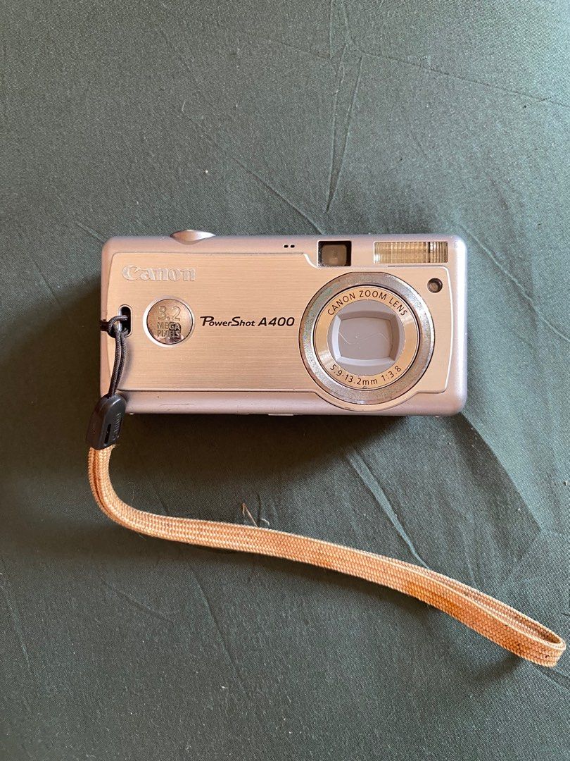 Canon PowerShot A400 – Vintage Digital Camera (3.2 MP) (Category: Cameras) located in Cavite. Submitted by namiikeii (Listing ID 1374520227, Image 1). Description: Selling my Canon PowerShot A400 – still turns on and can be used for basic shots or as a vintage/retro camera. 📷 Specs: 3.2 Megapixels 2.2x Optical Zoom Takes SD cards and AA batteries 🎁 Inclusions: Camera unit only ❗Condition: Used, with minor scratches, but still powers on. Great f