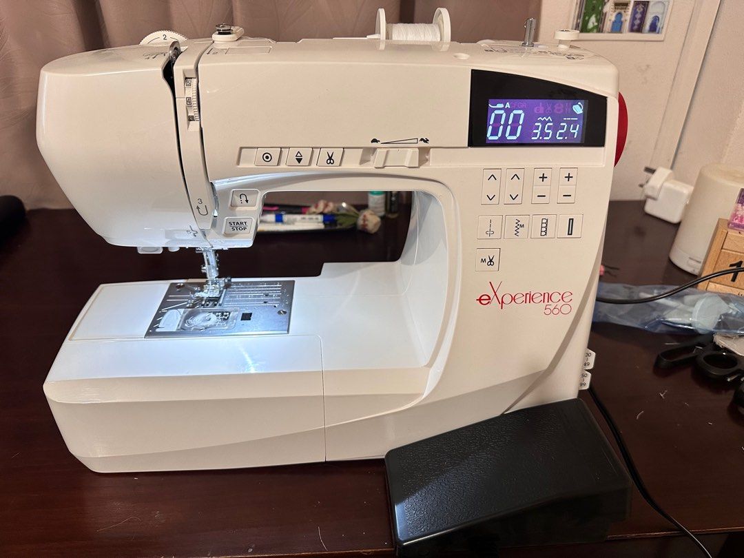 Elna Experience 560 Sewing Machine (Category: Other Home Appliances) located in Singapore. Submitted by shrimpruler (Listing ID 1374621424, Image 2). Description: Comes with all the attachments and footers. Instruction manual also included. Covered by 2 years of warranty. Bought in November 2024. .