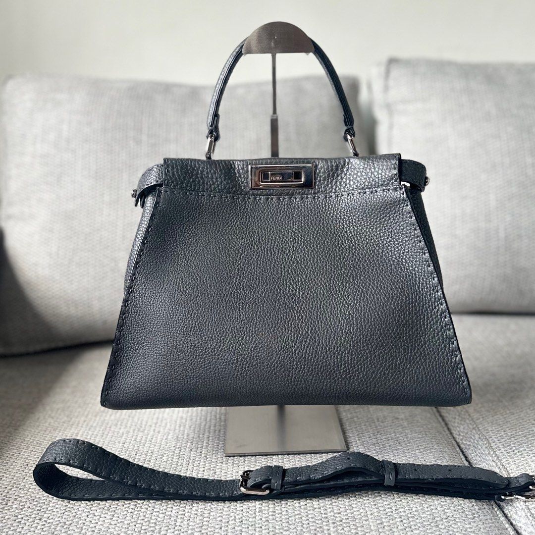 FENDI Peekaboo Medium - Gray (Category: Luxury Bags & Wallets) located in Paranaque City. Submitted by megsluxefinds (Listing ID 1374549627, Image 1). Description: IG: @megsluxfinds FENDI Peekaboo Medium - Gray Rank SA ₱115,000 Comes with care cards and raincoat Quiet luxury at its finest. Crafted from supple leather and finished with hand-stitched detailing, the Fendi Peekaboo is a timeless icon of understated elegance. Spacious, structured, and