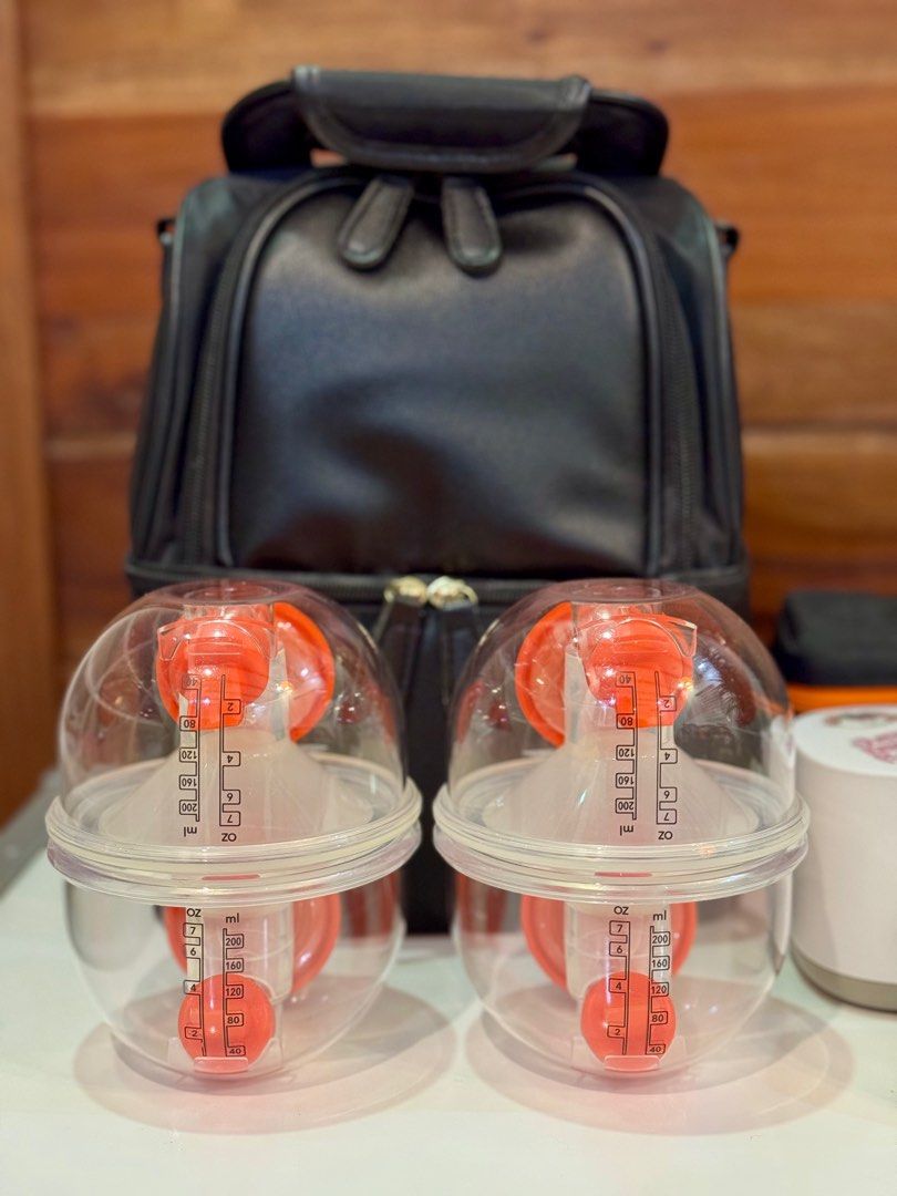 Imani i2 Plus Wearable Breast Pump Set (Category: Breastfeeding & Bottle Feeding) located in Libertad. Submitted by sambuico (Listing ID 1374575761, Image 3). Description: Finally selling my Imani i2 Plus Wearable Breast Pump Anyway, will be selling this as SET. Here are the inclusions: 1. Imani i2 Plus Wearable Breast Pump with charging dock (pair) 2. Additional 2 Imani crystal clear handsfree cups with silicon funnels 25mm and 21mm inserts, so 