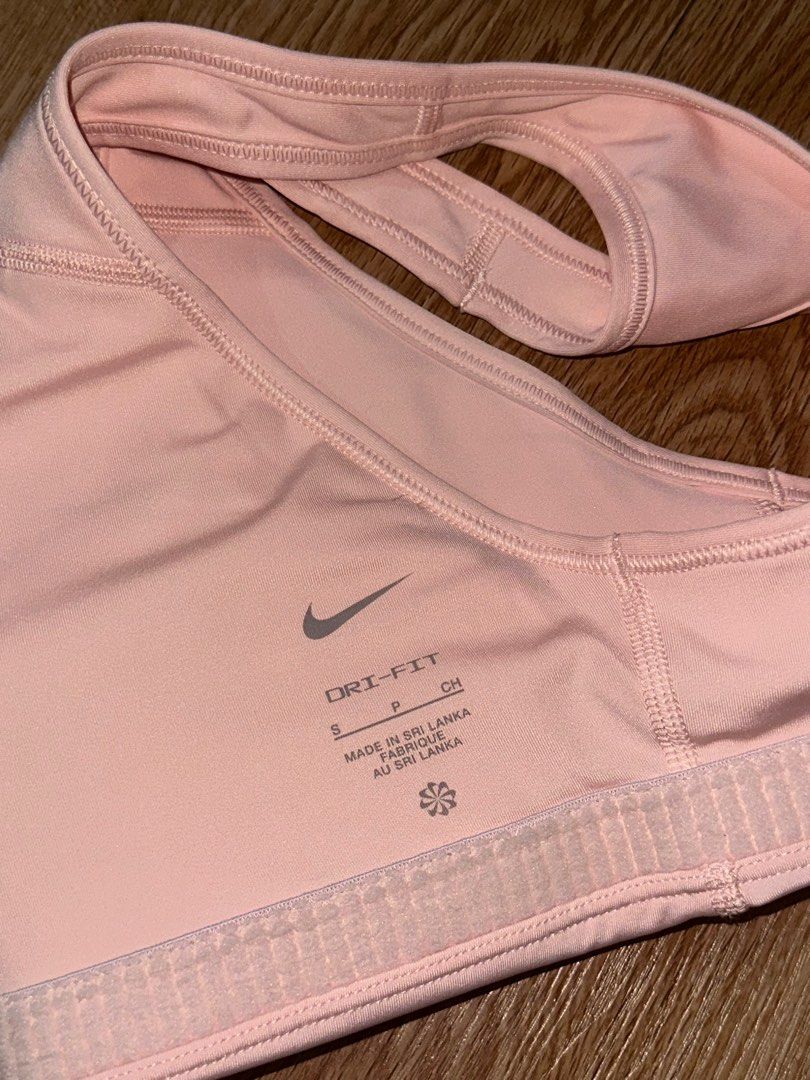 Nike Light Pink Sports Bra (Category: Activewear) located in Manila. Submitted by decluttering77 (Listing ID 1374522056, Image 3). Description: - 9/10 condition. has a pink sharpie dot but other than that, its in super good condition - original, authentic product - size s on tag - padded but can be removed MOP: Gcash, GoTyme *will not ship unless fully paid.