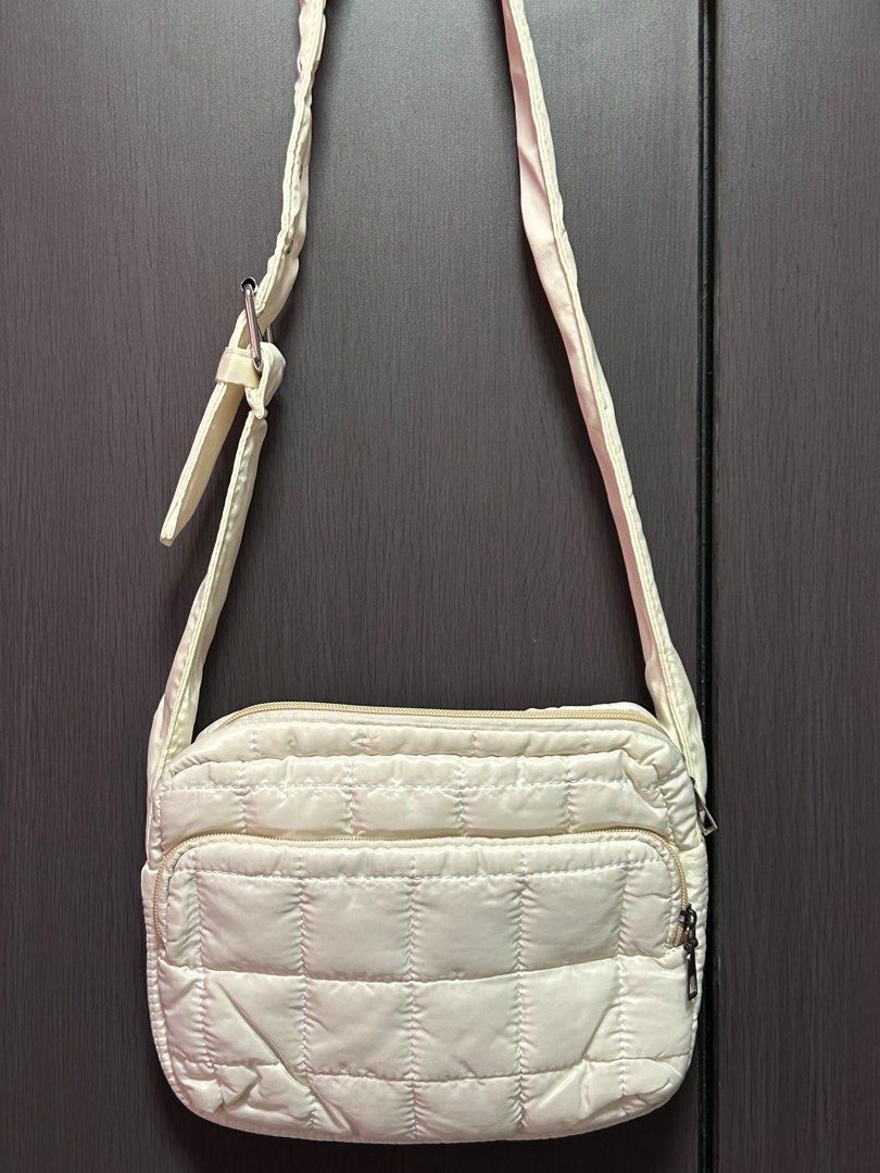 Puffy padded crossbody shoulder bag (Category: Cross-body Bags) located in Singapore. Submitted by bluetulipz (Listing ID 1374589805, Image 3). Description: Selling a small puffy plaid crossbody bag. Colour is white. Tag: Sofia label, paper bunny, tsl, tpb, mango, Zara, Charles, Pedro, puffer.