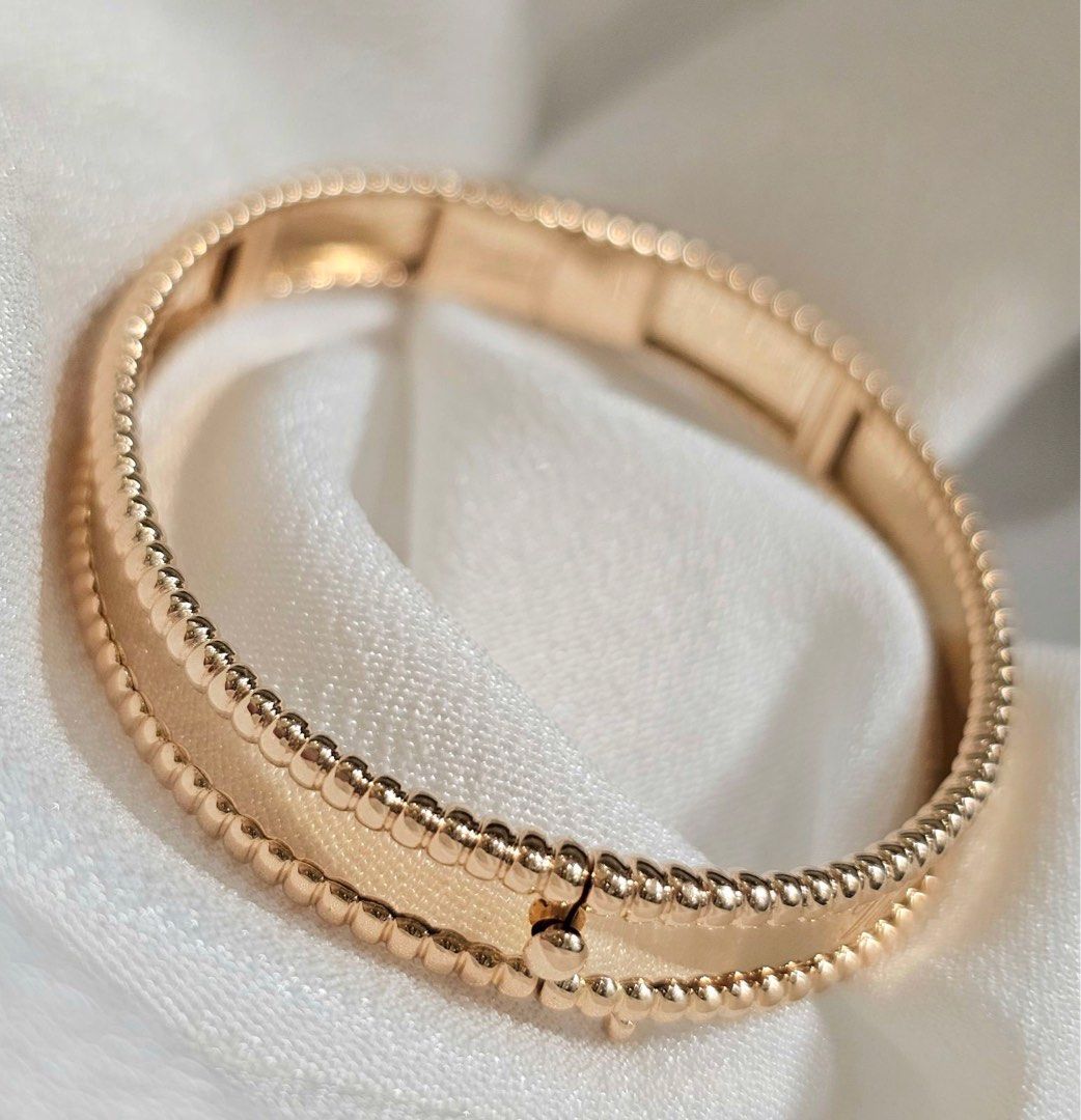 Van Cleef & Arpels Perlée Signature Bracelet (Category: Bracelets) located in Manila. Submitted by mnlwatchsociety (Listing ID 1374579928, Image 2). Description: This Van Cleef & Arpels Perlée Signature bracelet in 18K rose gold is a celebration of refined elegance. Gleaming golden beads trace the edges in perfect symmetry, while the Maison’s name is delicately engraved—a subtle testament to heritage and craftsmanship. A timeless signature for th