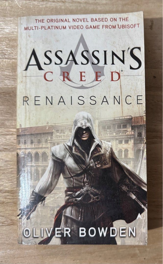 Assassin’s Creed Renaissance - Oliver Bowden (Category: Storybooks) located in San Pedro. Submitted by pageturner19 (Listing ID 1374855705, Image 1). Description: With foxing and tanned pages; the top edge of last few pages have water marks (all pages are readable).