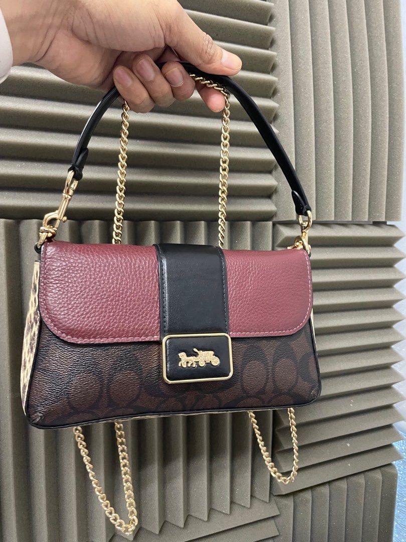 COACH Tricolor Mini Grace Two Way Bag (Category: Luxury Bags & Wallets) located in Manila. Submitted by luxemax_09 (Listing ID 1374814737, Image 1). Description: Gender: Ladies’ Material: Signature coated canvas, refined pebble leather, smooth leather and snake-embossed leather Stamp: F2232 CC033 Interior: One compartment with Three open pockets Measurements: 8.9”L X 2”W X 5”H Handle Drop: 5” Hardware: Gold tone Inclusions: Original dust bag, Rem
