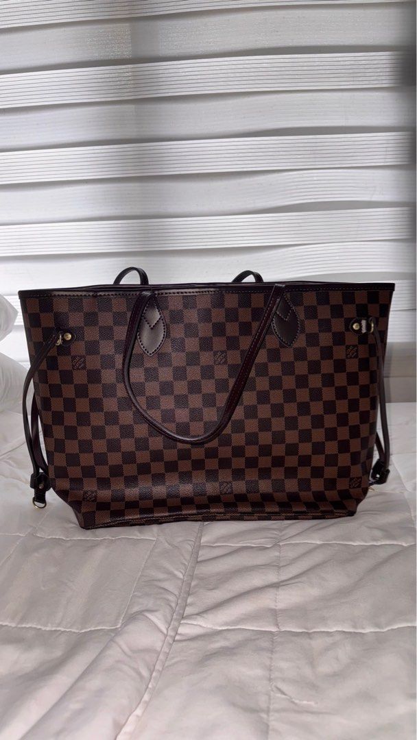 LV Neverfull (Category: Luxury Bags & Wallets) located in Pasig City. Submitted by liberty_closet_ph (Listing ID 1374718379, Image 1). Description: - Grab or lalamove only - location: Pasig - RFS: not using #bag #LVNeverfull #totebag #fashion.