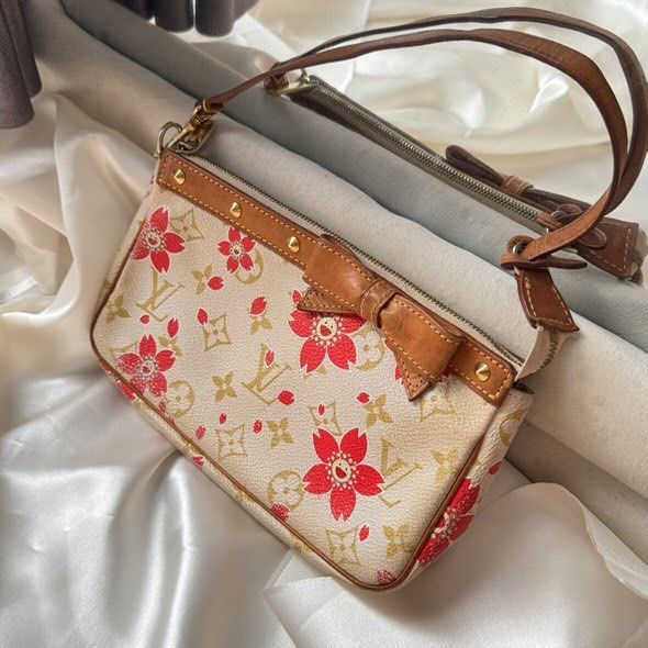 LV Pochette Accessoires Takashi Murakami Limited Edition Red Monogram Cherry Blossom (Category: Bags & Wallets) located in Singapore. Submitted by gracel00 (Listing ID 1374738185, Image 1). Description: Louis Vuitton Pochette Accessories Authentic 100% This bag was purchased from a trusted seller last year, the reason for selling is because it is rarely used so I decided to resell it. Comes with long sling strap and replacement dustbag only Condi