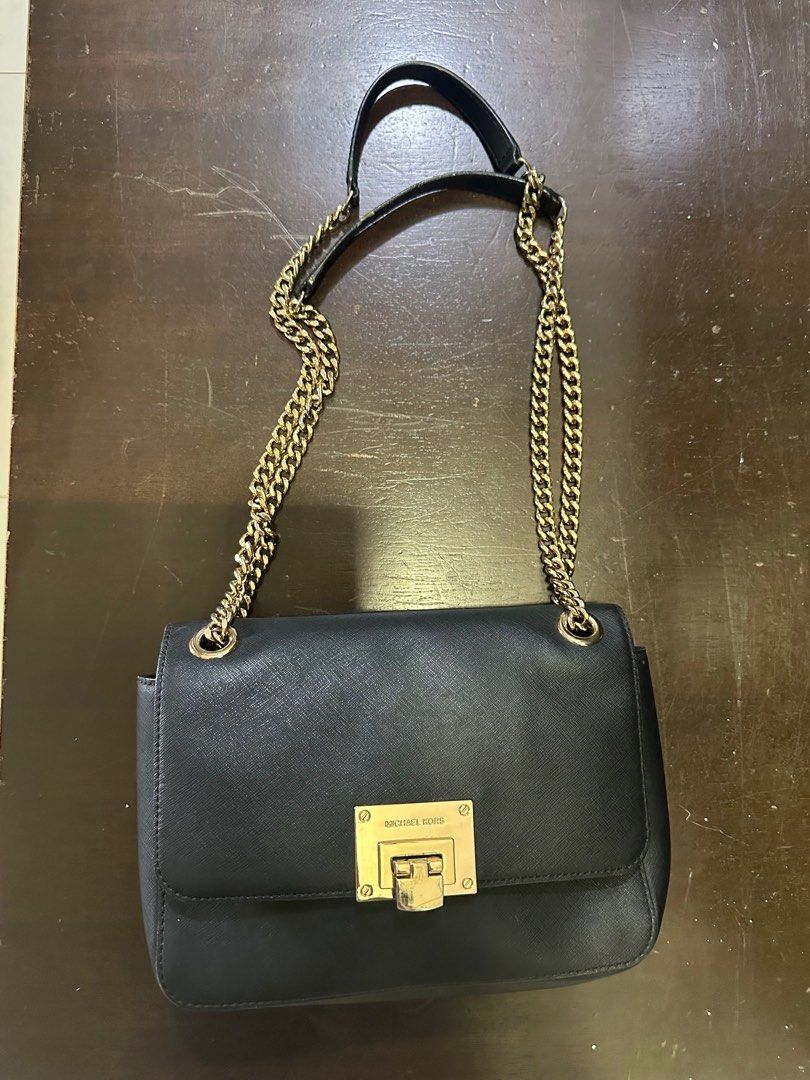 Michael Kors small leather handbag (Category: Bags & Wallets) located in Singapore. Submitted by checkmate8 (Listing ID 1374721678, Image 1). Description: A light durable full leather bag with chain shoulder strap. Clearing for space at home . Super sale at $80.