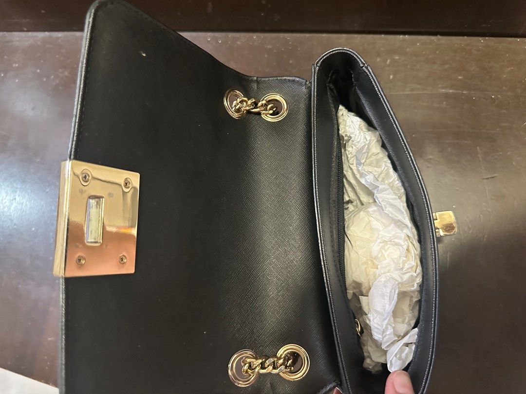 Michael Kors small leather handbag (Category: Bags & Wallets) located in Singapore. Submitted by checkmate8 (Listing ID 1374721678, Image 3). Description: A light durable full leather bag with chain shoulder strap. Clearing for space at home . Super sale at $80.