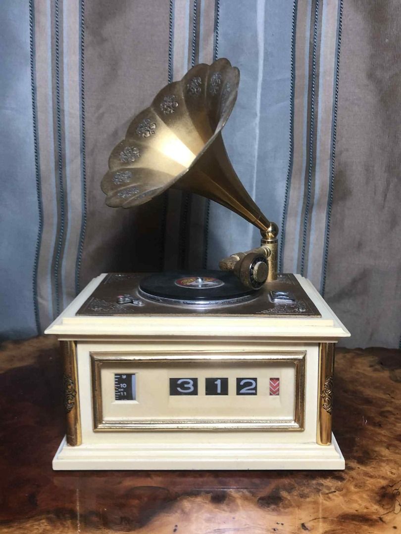 Phonograph-style flip clock (Category: Clocks) located in Davao. Submitted by antiquesandvintagestuffsPH (Listing ID 1374831135, Image 2). Description: Made in Japan clock and alarm are in very good working condition 1x size c battery This is not a record player! this is a Flip clock with a record player design!.