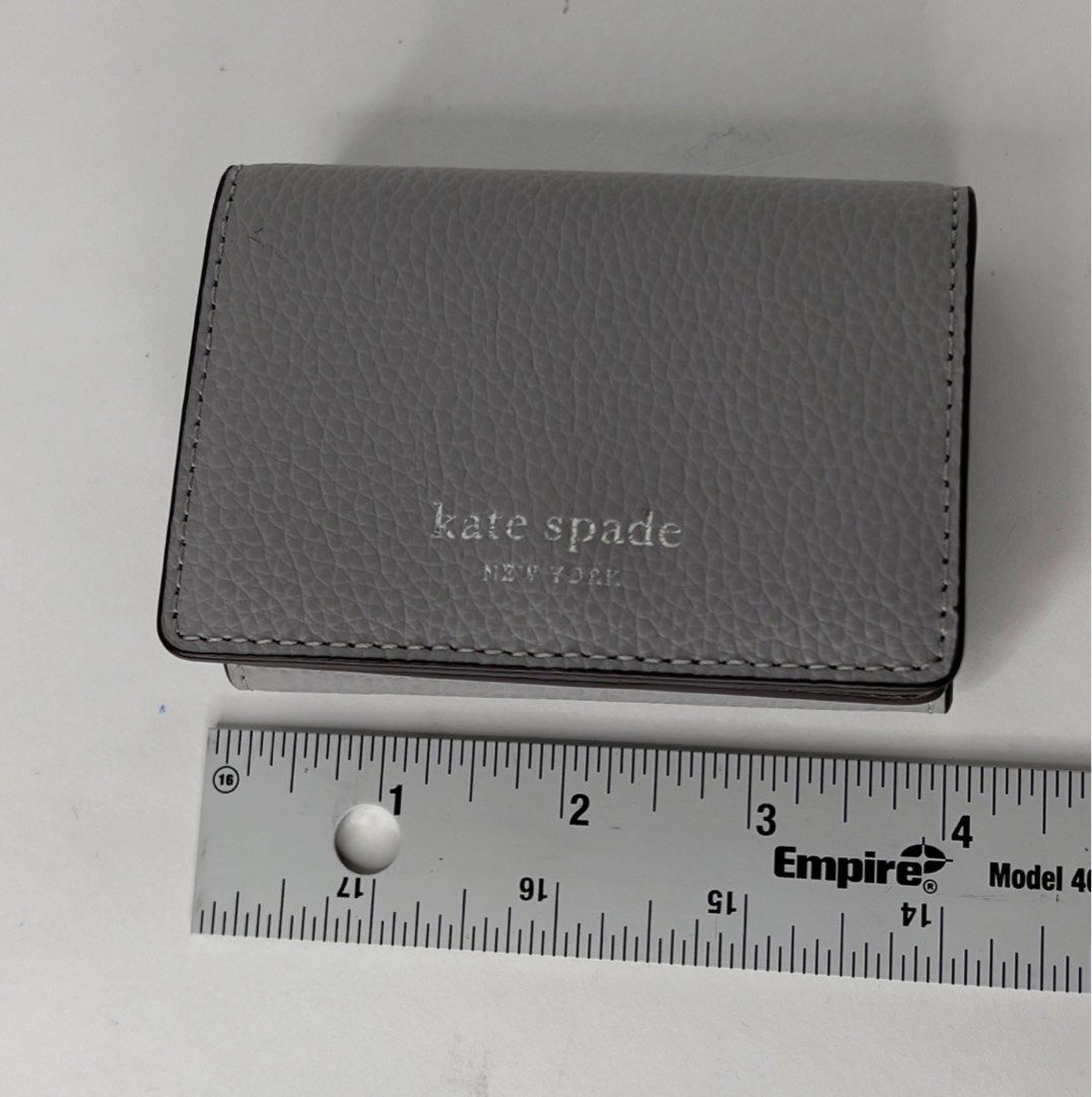AUTHENTIC/ORIGINAL KateSpade Staci Micro Tri Fold Small Grey Wallet (Category: Luxury Bags & Wallets) located in Pasig City. Submitted by 3dsbagcollectionbydiane (Listing ID 1374909863, Image 3). Description: used once lang. can pass as brandnew Wala na paperbag and tag Bought in US pasabay PM for more details.