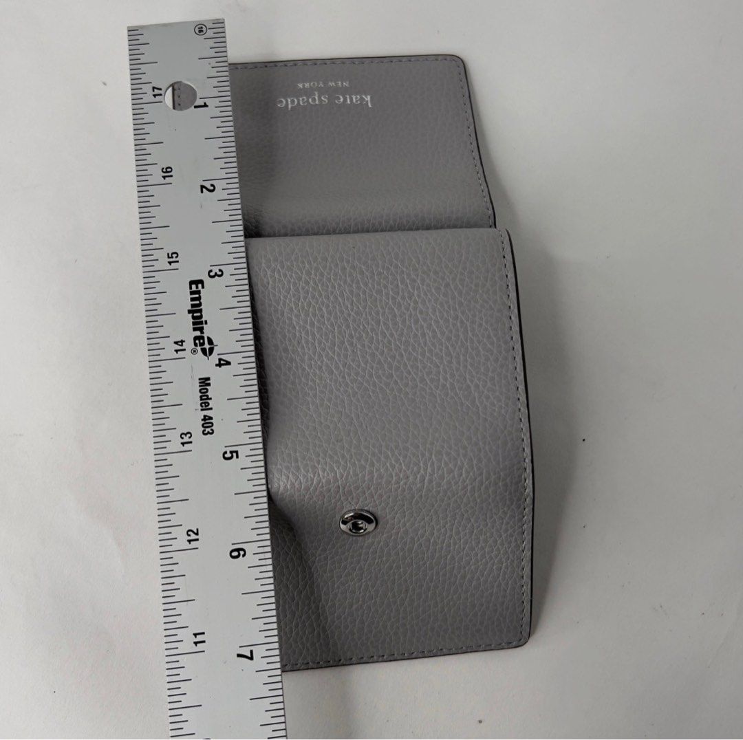 AUTHENTIC/ORIGINAL KateSpade Staci Micro Tri Fold Small Grey Wallet (Category: Luxury Bags & Wallets) located in Pasig City. Submitted by 3dsbagcollectionbydiane (Listing ID 1374909863, Image 2). Description: used once lang. can pass as brandnew Wala na paperbag and tag Bought in US pasabay PM for more details.