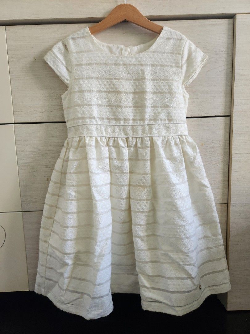 BloomB Dress - 11-12 y.o.- Off white (Category: Babies & Kids Fashion) located in Singapore. Submitted by genevoise21 (Listing ID 1374930715, Image 1). Description: Bloom B dress, in off white with Light weight cotton lining. approx. 75 cm from shoulder to hem. Used only once, for a first communion..