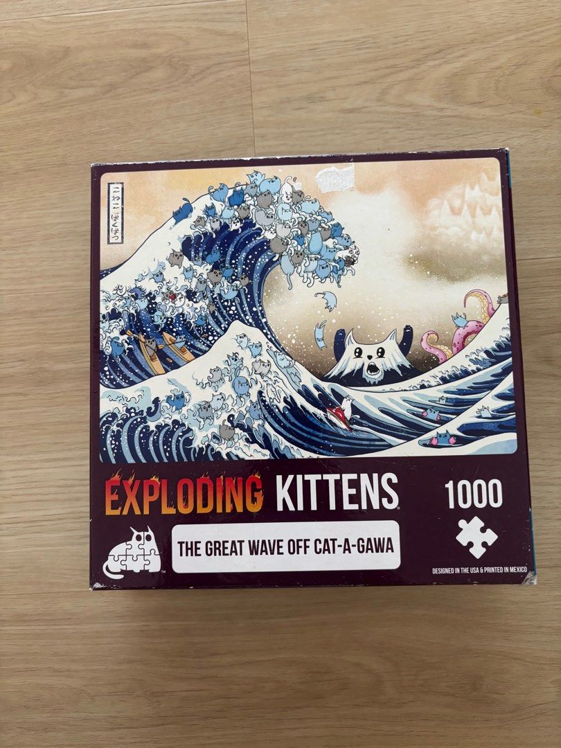 Exploding kitten puzzle (Category: Board Games & Puzzles) located in Singapore. Submitted by __t__ (Listing ID 1374985340, Image 1). Description: No missing pieces Box is slightly damaged as shown in photos but puzzle itself has no defect Nego for fast deals.